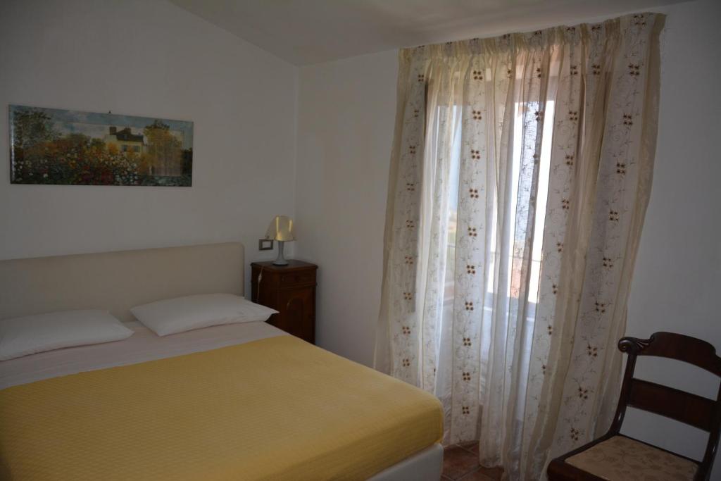 Postel nebo postele na pokoji v ubytování B&B La Casa Rossa