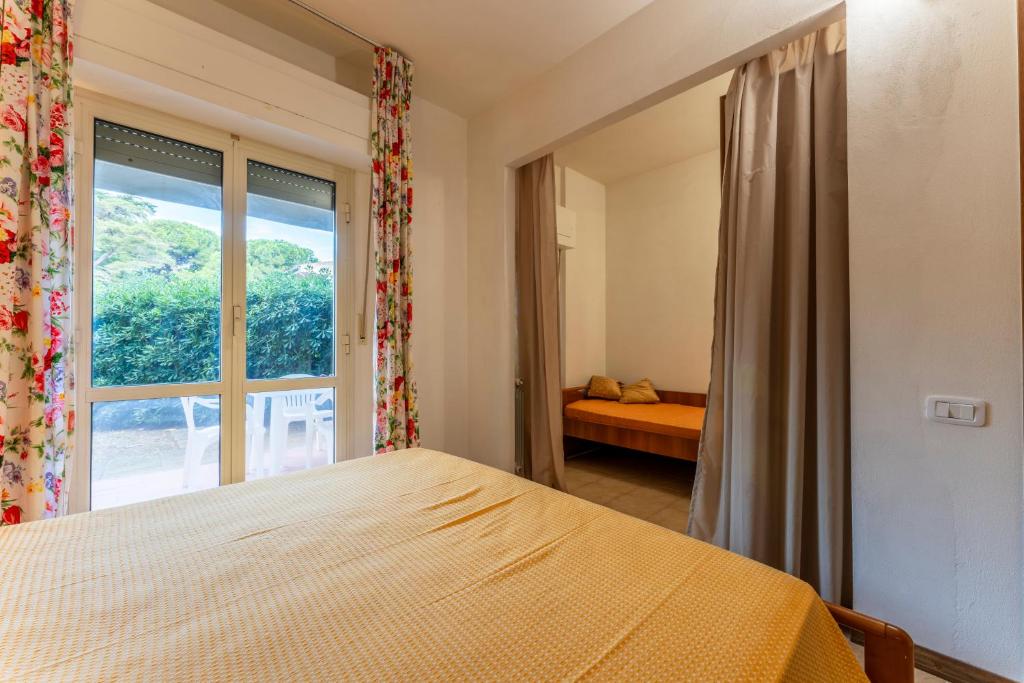 Postel nebo postele na pokoji v ubytování Giannella Beach Residence Apartment