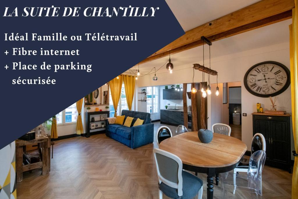 a living room with a wooden table and a dining room at La Suite de Chantilly - Appartement de 80m2 avec Jacuzzi privé ! in Chantilly