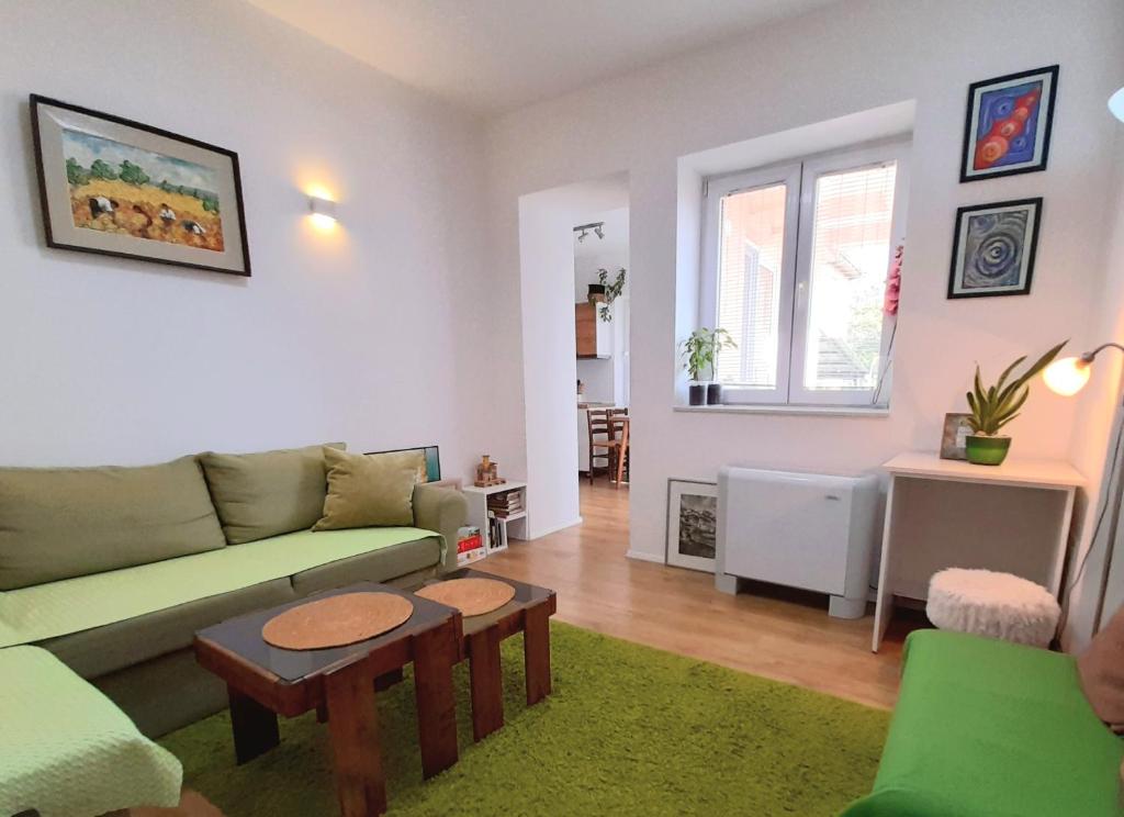 a living room with a couch and a table at Central Modern Apt with Garden in Struga