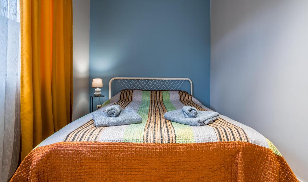 Postel nebo postele na pokoji v ubytování Roshka 2 BD Apart 501
