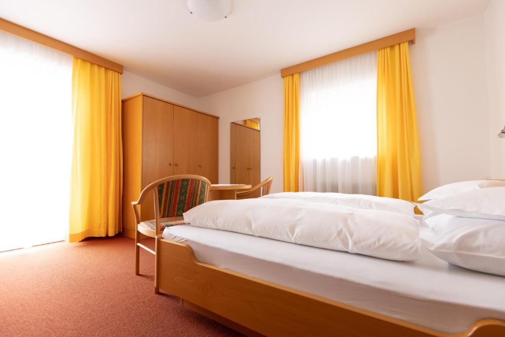 Postel nebo postele na pokoji v ubytování Garni Juval