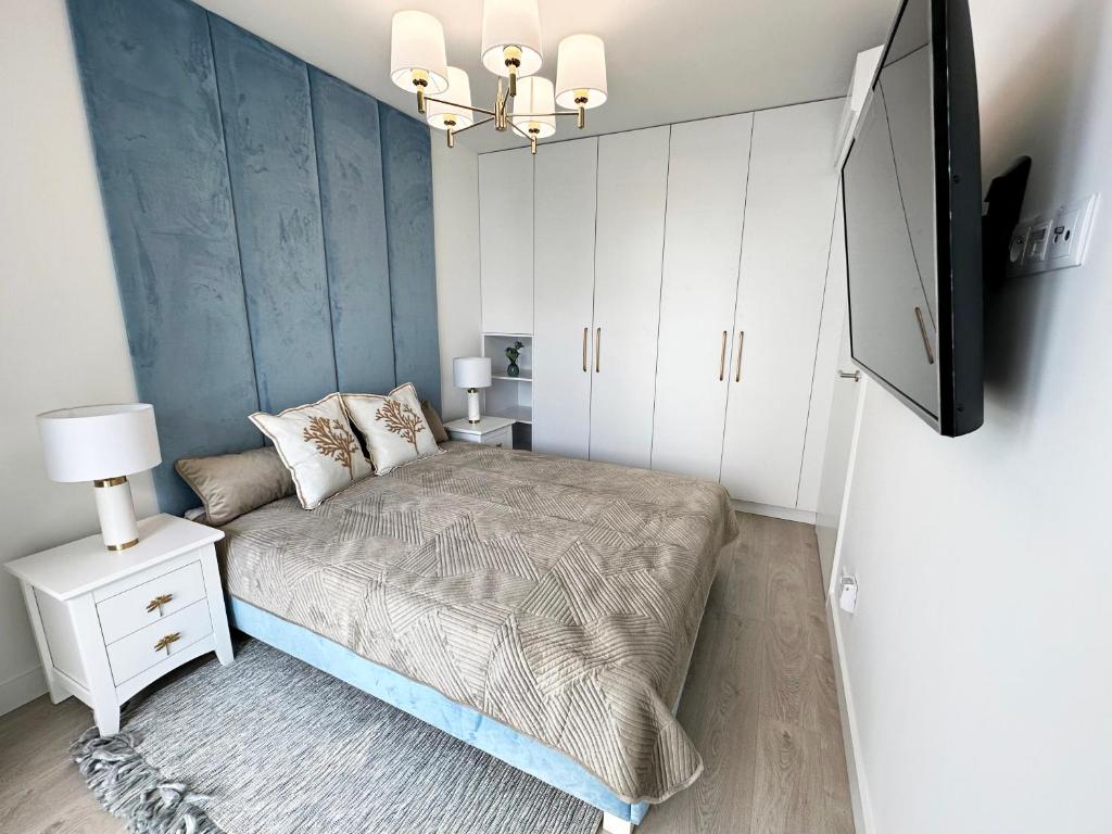 Postel nebo postele na pokoji v ubytování Wave by Baltic Home
