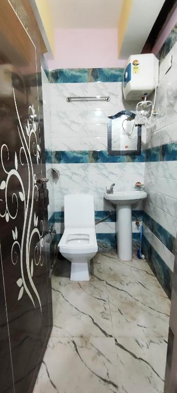 Koupelna v ubytování Sai Saraswati Homestay