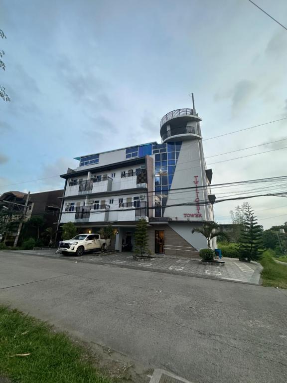 a building with a watch tower on top of it at Twilight Tower in Ormoc