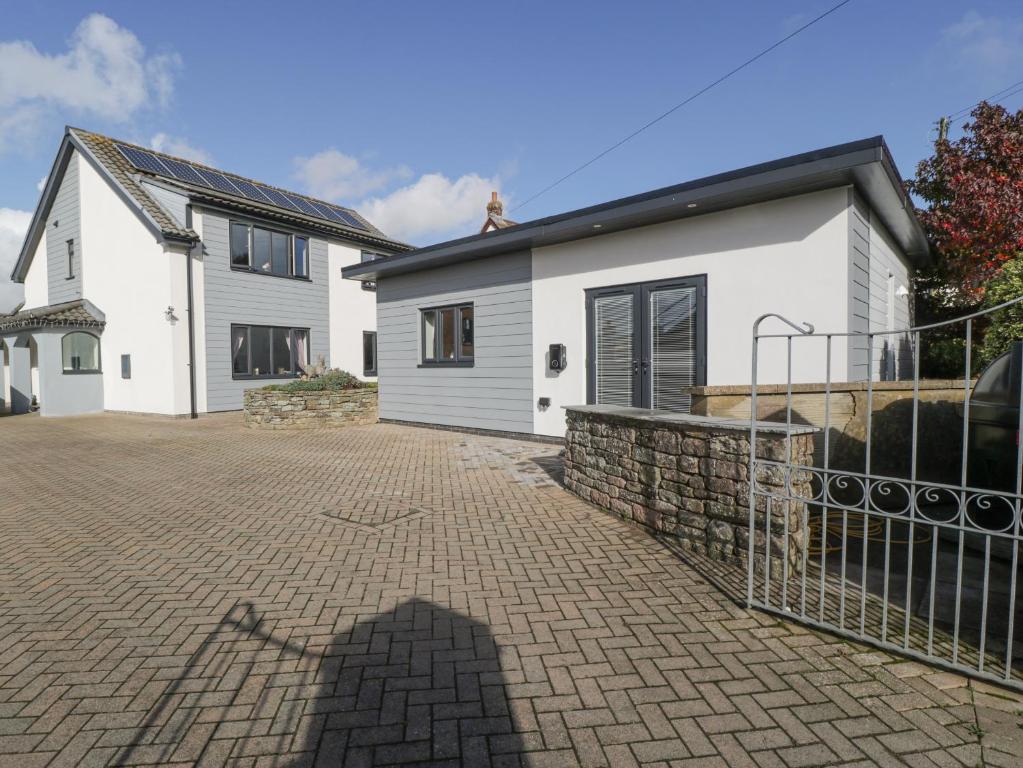 a house with a brick driveway in front of it at Aneths Annex in Drybrook