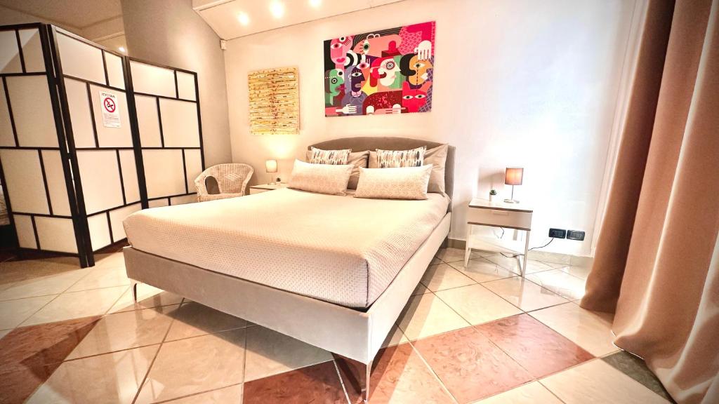 Postel nebo postele na pokoji v ubytování Amarin Pisa Room
