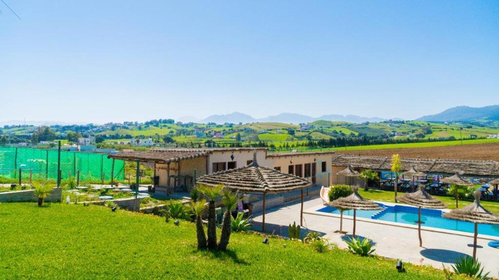 an aerial view of a villa with a swimming pool at LA GRANJA in Tetouan