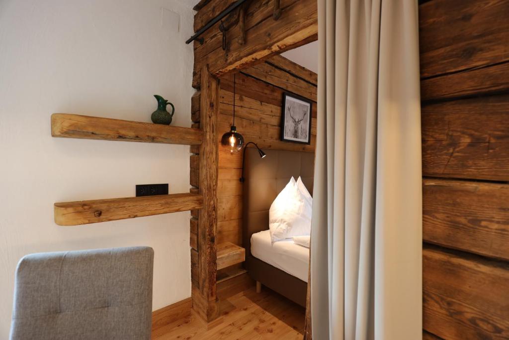 Postel nebo postele na pokoji v ubytování Pension & Appartements Ronacherhof