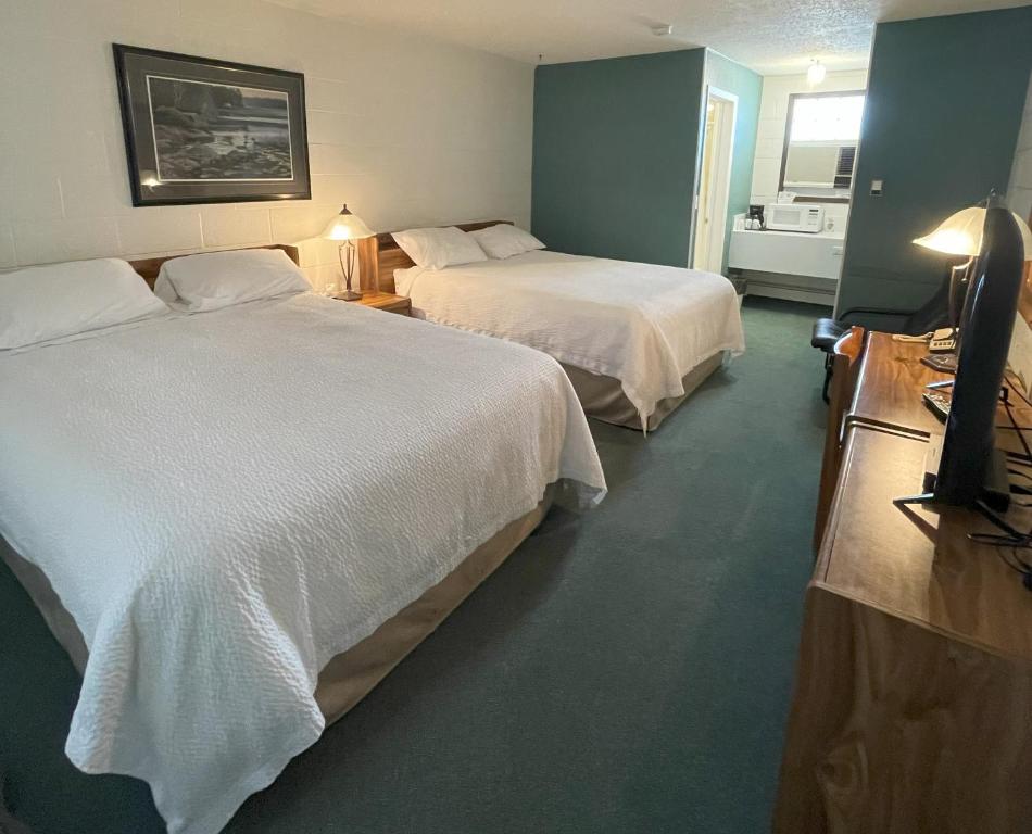 Postel nebo postele na pokoji v ubytování Rest Easy Motel