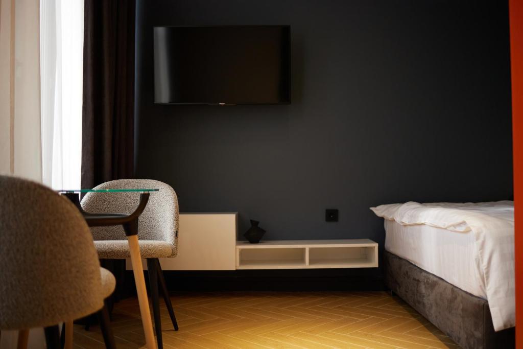 TV a/nebo společenská místnost v ubytování BARBAR APART HOTEL