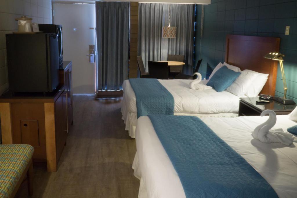 Postel nebo postele na pokoji v ubytování Charlroy Motel