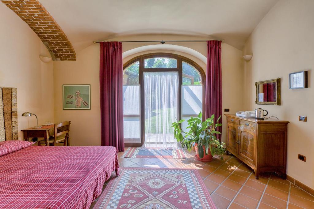 Postel nebo postele na pokoji v ubytování B&B Cascina Moncrava