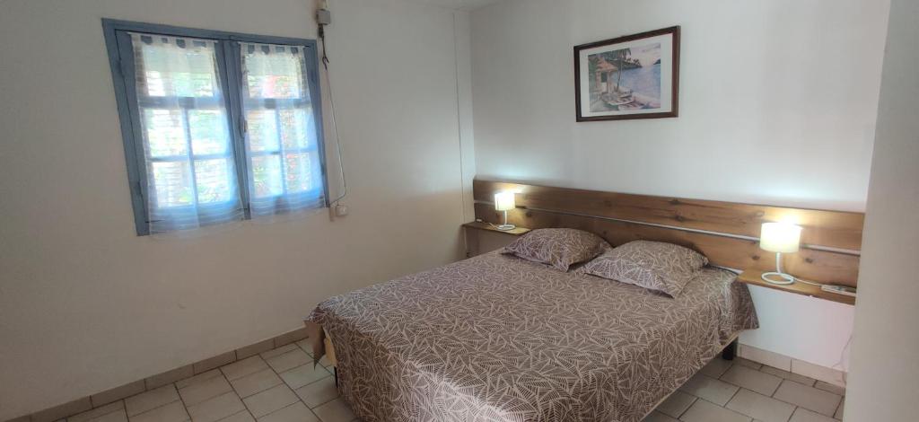 En eller flere senge i et værelse på Fête à la Guadeloupe (SI)