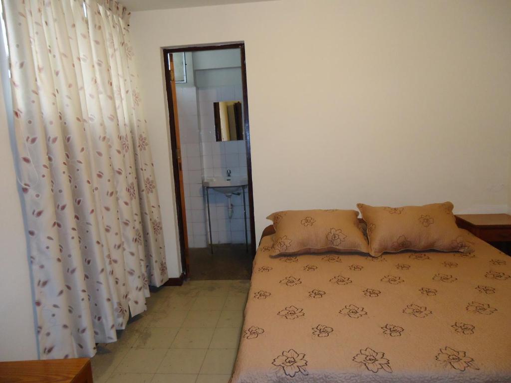 Voodi või voodid majutusasutuse Hotel Estación Central toas
