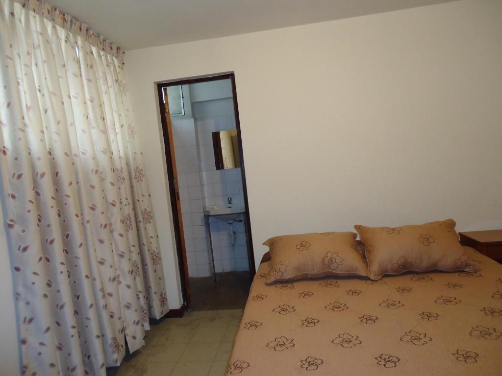 Voodi või voodid majutusasutuse Hotel Estación Central toas