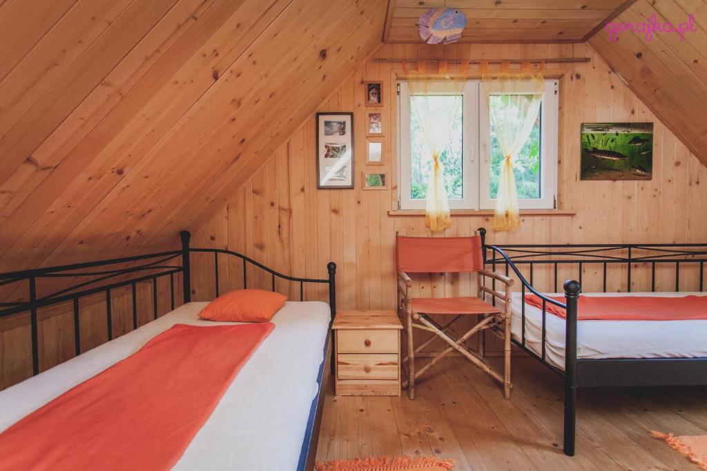 Postel nebo postele na pokoji v ubytování Domki Karaibskie