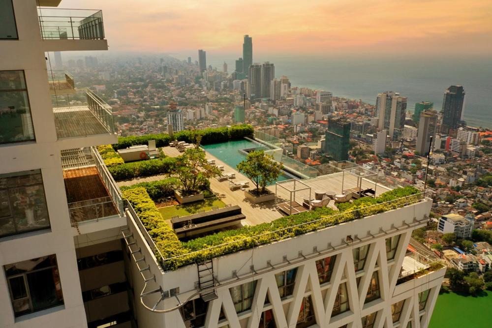 a building with a rooftop garden on top of it at Altair Luxury Colombo by Miracle in Colombo