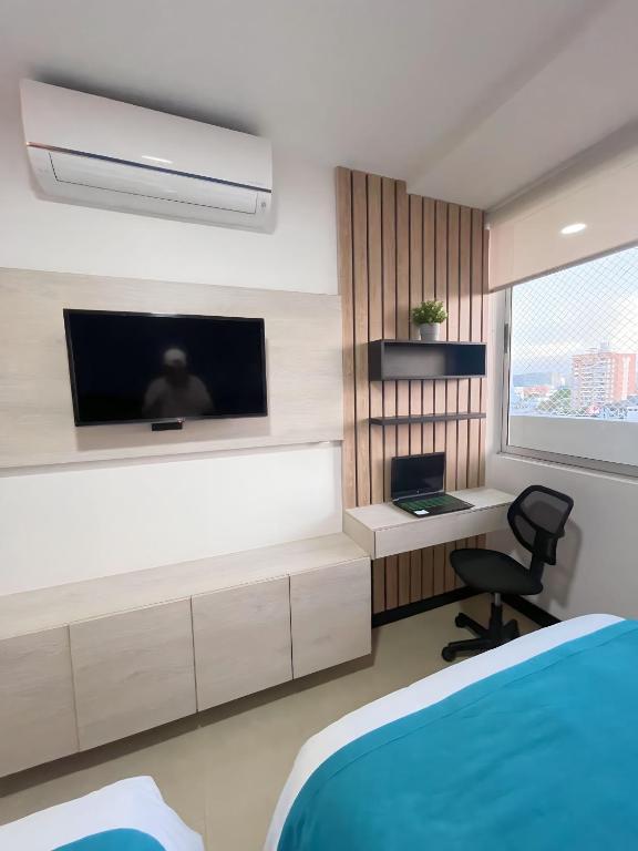TV a/nebo společenská místnost v ubytování Atlantis Suites BAQ -Apartamento Moderno-2-BD