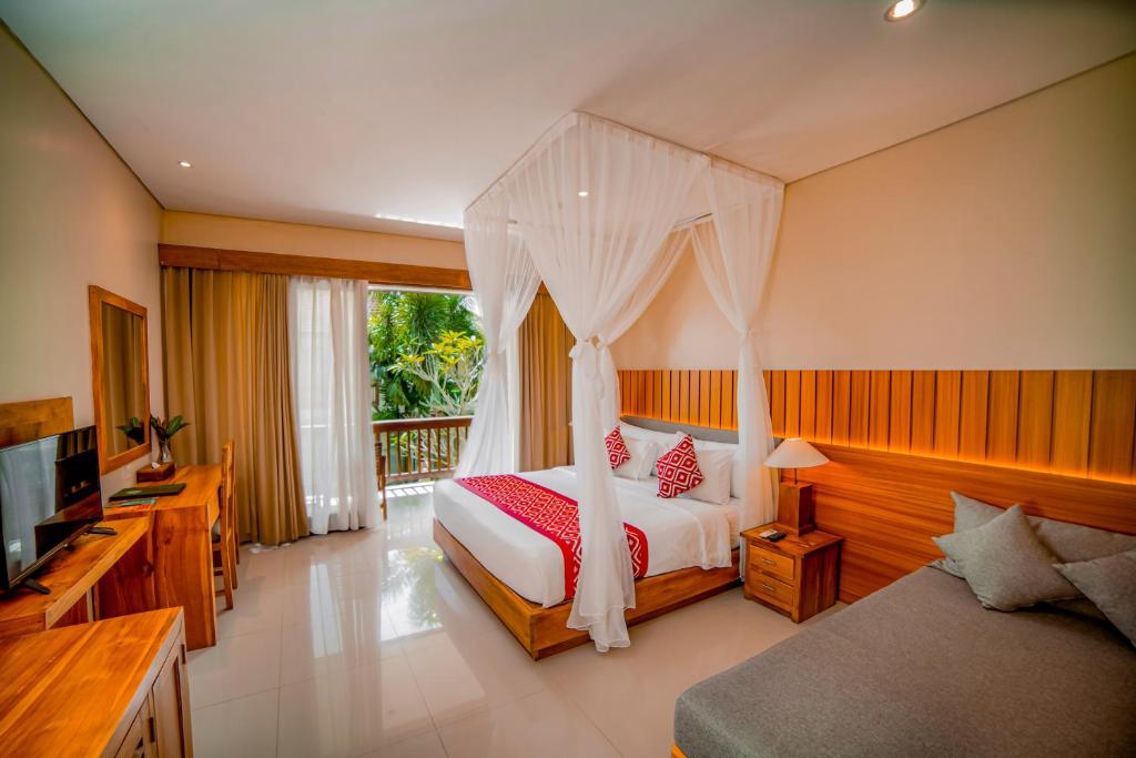 Postel nebo postele na pokoji v ubytování Pertiwi Bisma Ubud
