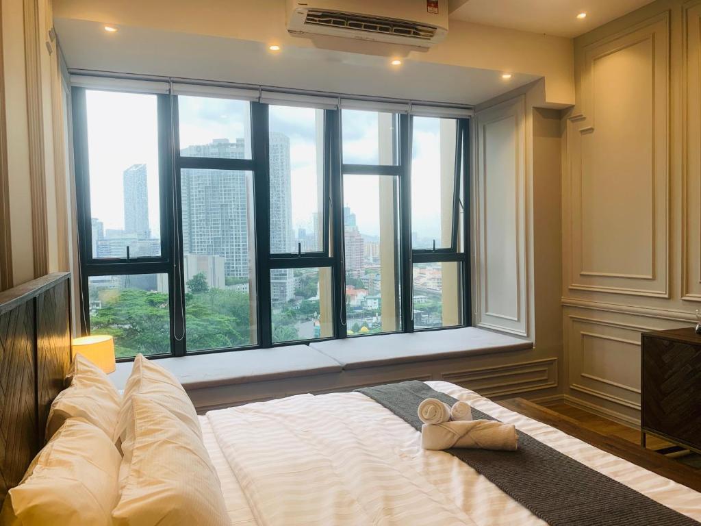 Postel nebo postele na pokoji v ubytování Ceylonz Suites by ROOMY