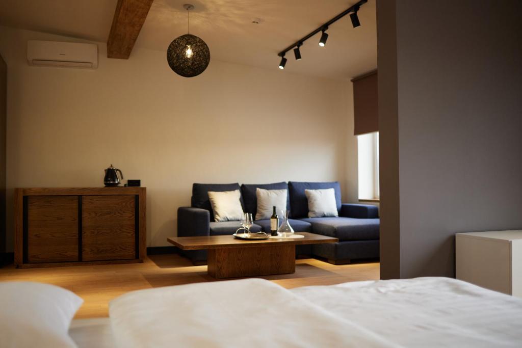 Säng eller sängar i ett rum på BARBAR APART HOTEL
