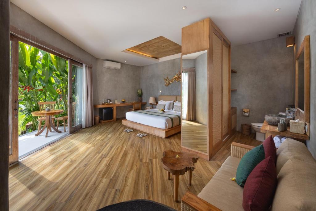 Postel nebo postele na pokoji v ubytování TheWakanda Resort A Pramana Experience
