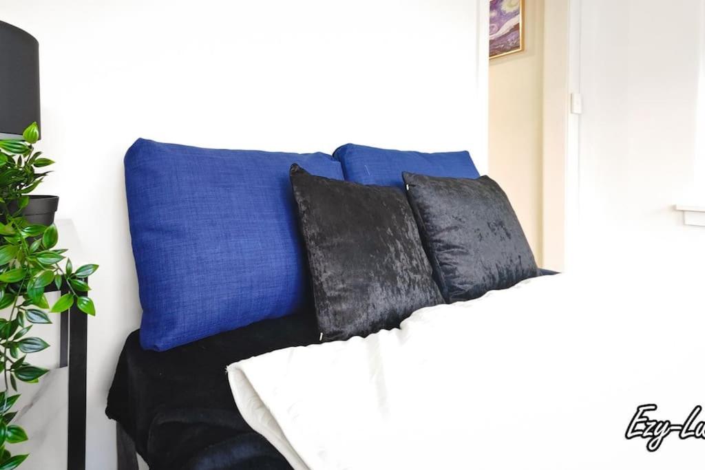 a couch with four pillows on top of it at MCG Best Unit For Fireworks 1BR Sleeps3 in Melbourne
