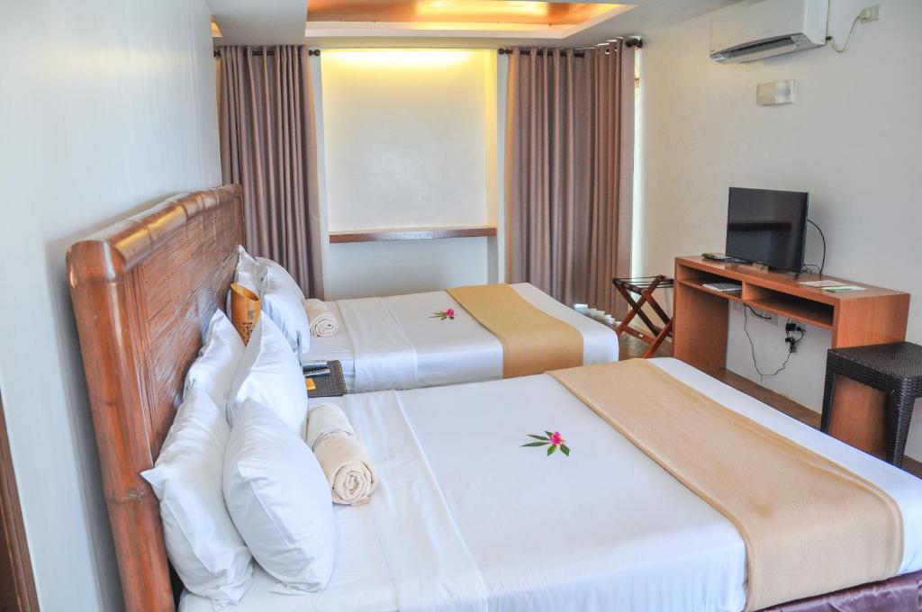 Postel nebo postele na pokoji v ubytování Acuaverde Beach Resort