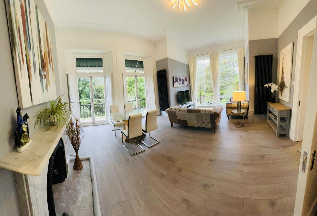 a living room with a couch and a table at Luxury garden flat under the Castle in Kent