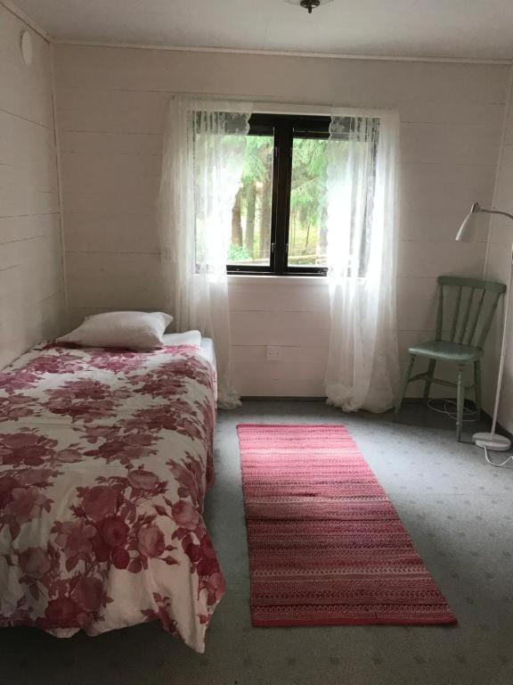 Postel nebo postele na pokoji v ubytování Lillemyrsgården