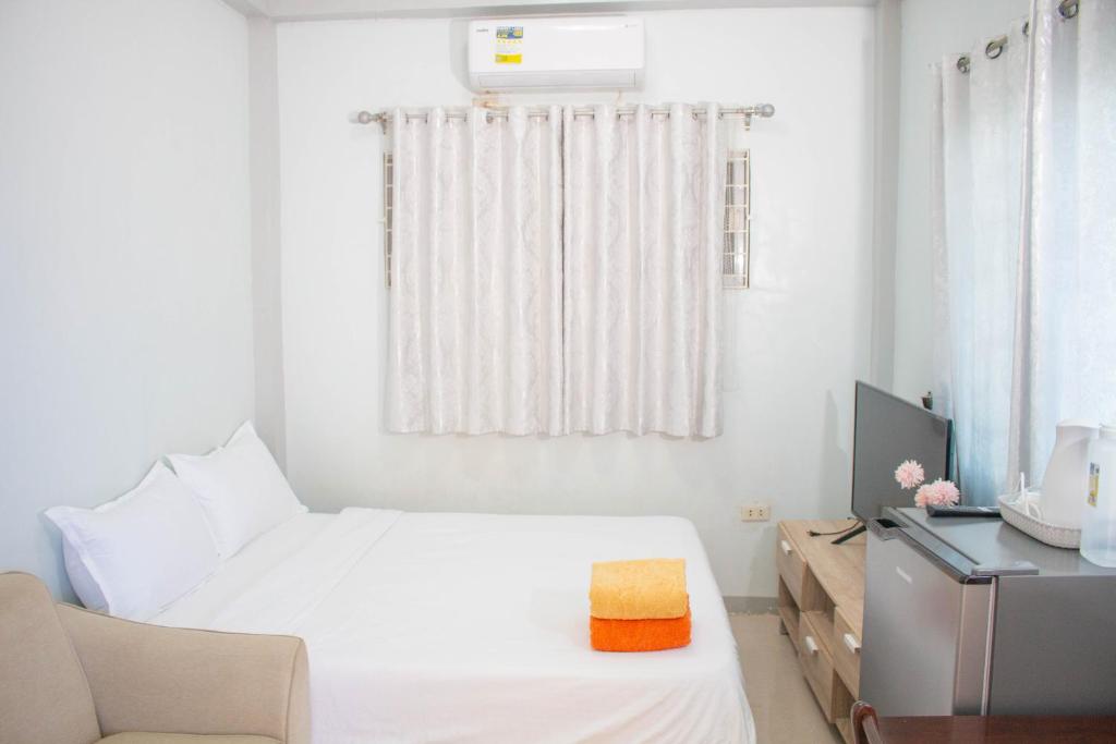 Postel nebo postele na pokoji v ubytování Vitasolo Hometel & Suite