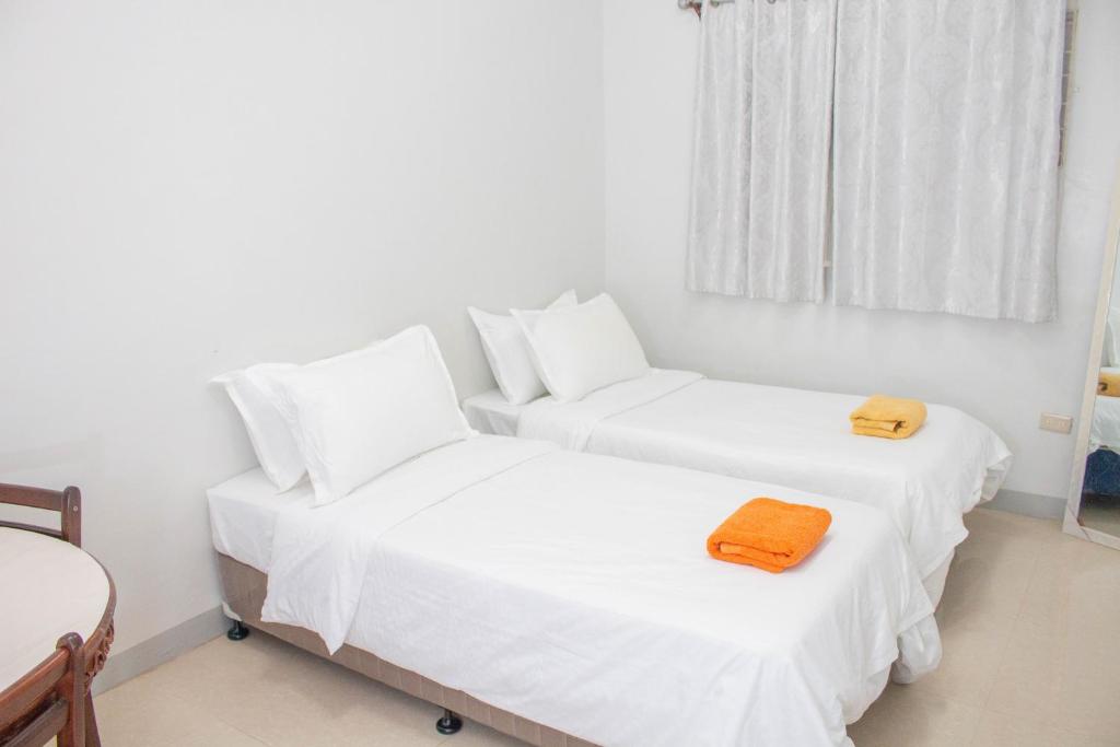 Postel nebo postele na pokoji v ubytování Vitasolo Hometel & Suite