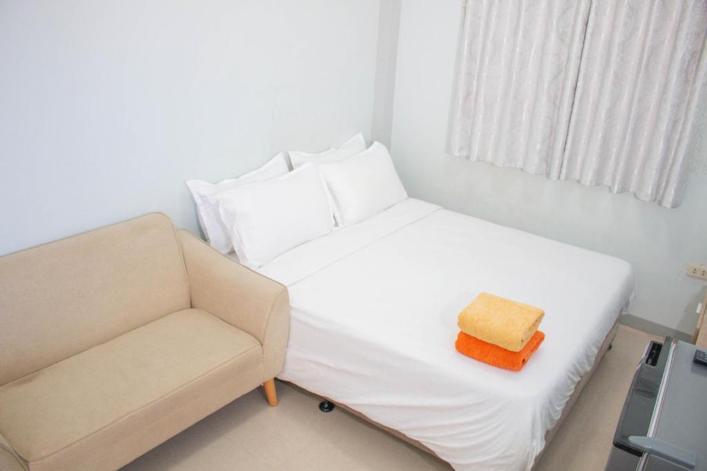 Postel nebo postele na pokoji v ubytování Vitasolo Hometel & Suite