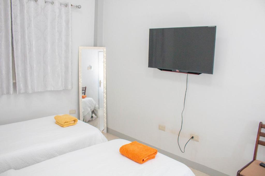 Postel nebo postele na pokoji v ubytování Vitasolo Hometel & Suite