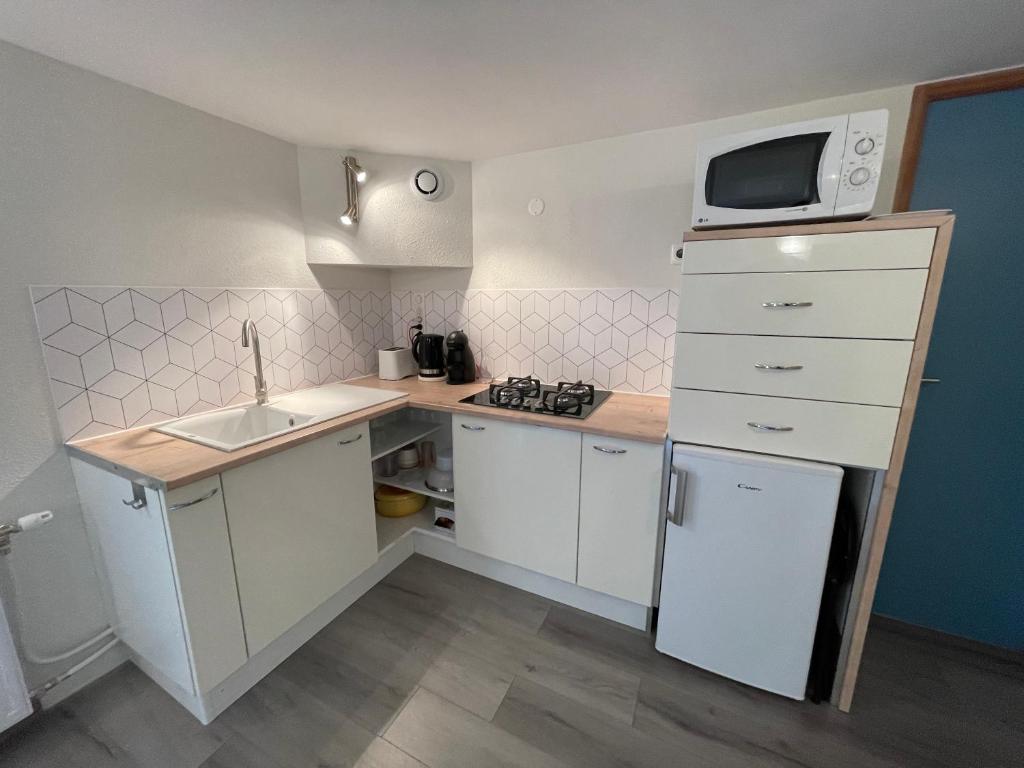 Kuchyň nebo kuchyňský kout v ubytování Appartements Barcelonnette