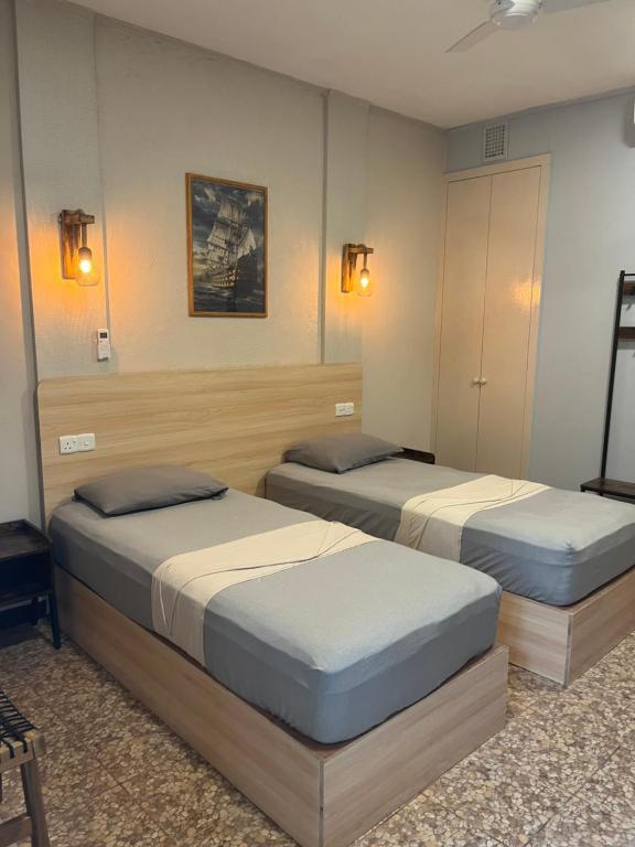 Postel nebo postele na pokoji v ubytování Dive Villa Thoddoo