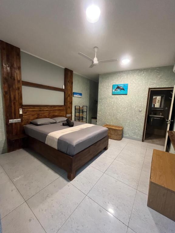 Postel nebo postele na pokoji v ubytování Dive Villa Thoddoo
