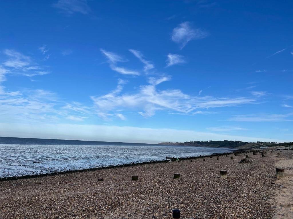 a beach with a large body of water at Minster Leas in Sheerness