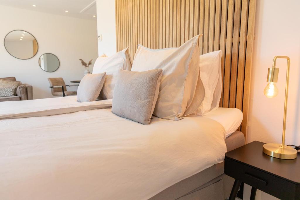 מיטה או מיטות בחדר ב-Bed & Bike Op Texel