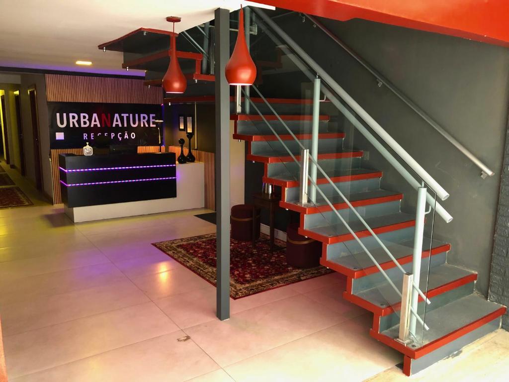 a set of stairs in a lobby of a building at Urbanature Filme e Arte BC in Balneário Camboriú