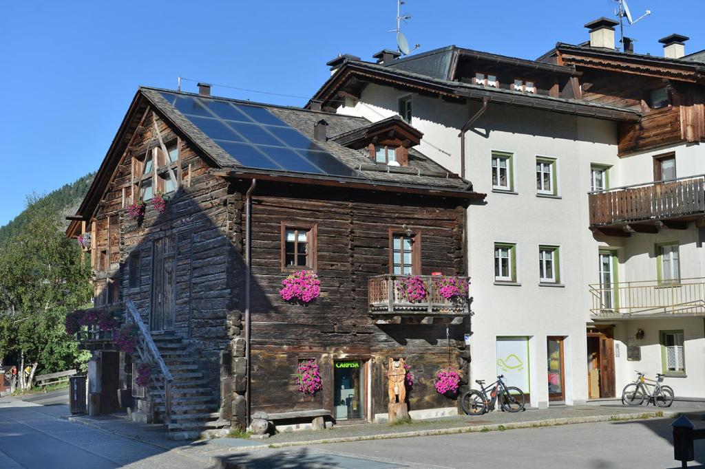 a house with a solar panel on the roof at Bait dal Colocator in Livigno