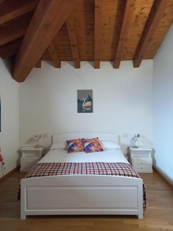 Postel nebo postele na pokoji v ubytování La Corte del Cigno