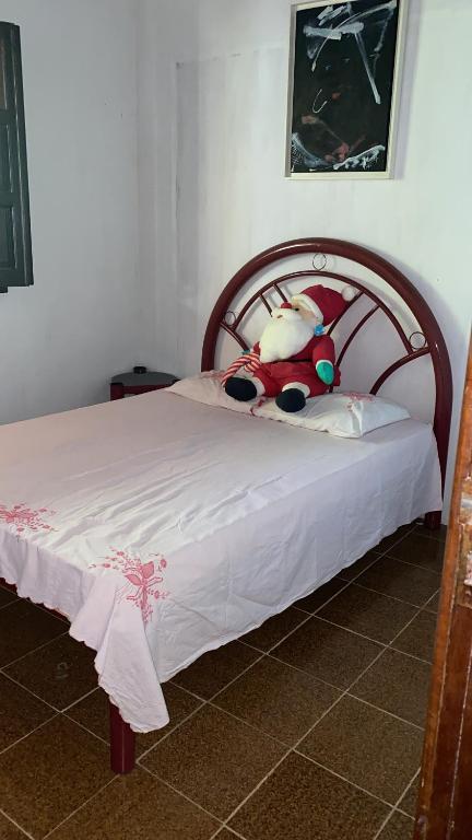 A bed or beds in a room at Casa ampla de frente ao mar