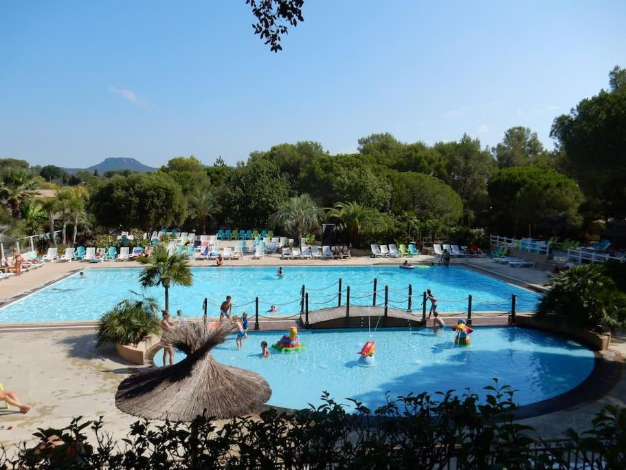 a group of people in a swimming pool at Mobile home 5-pers Camping Leï Suves-Côtes d&#39;Azur-including airco in Roquebrune-sur-Argens