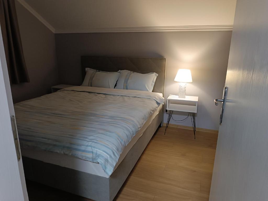 Postel nebo postele na pokoji v ubytování Apartman Ana