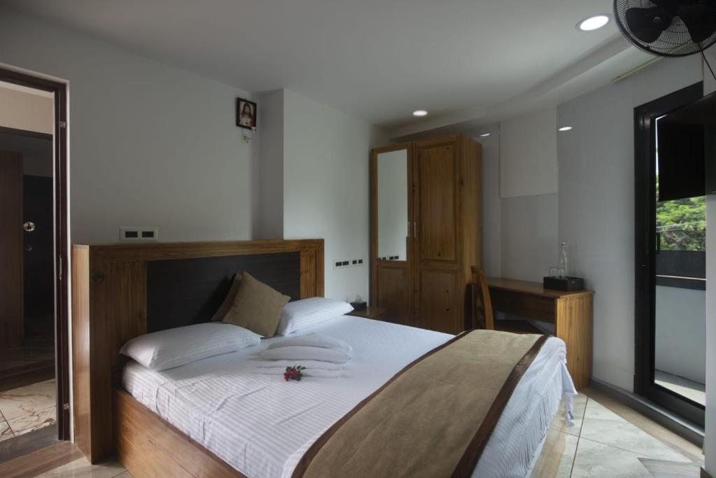 Postel nebo postele na pokoji v ubytování Magni Home