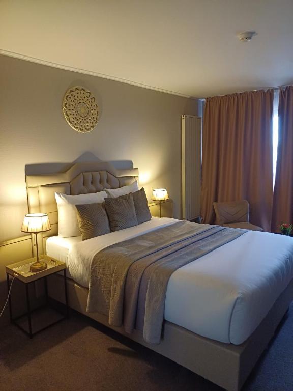 Postel nebo postele na pokoji v ubytování Park Hotel Airport