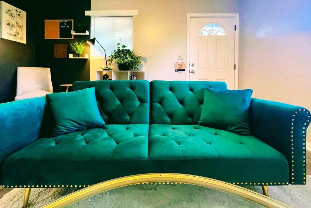 a blue couch sitting in a living room at The Getaway at Palm Dr in Atlanta