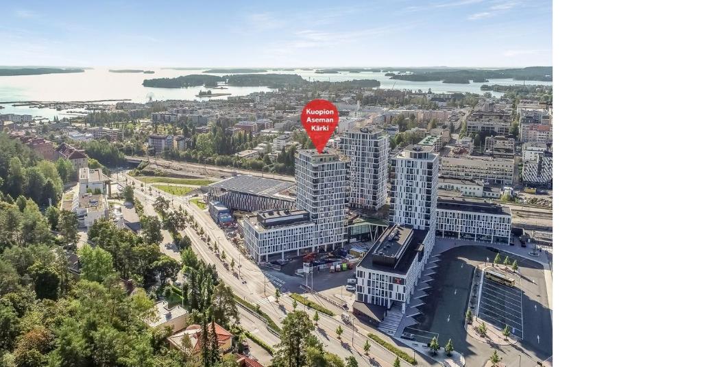 an aerial view of a city with a stop sign on a building at Studio 12 floor, Puijo landscape, Free parking in Kuopio